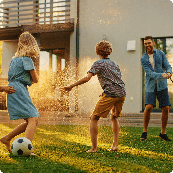 family-playing-soccer-in-backyard.png